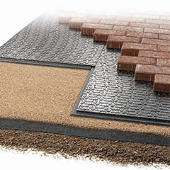 Paver sheets of ARPRO in between a layer of gravel and brick, used to lay patios