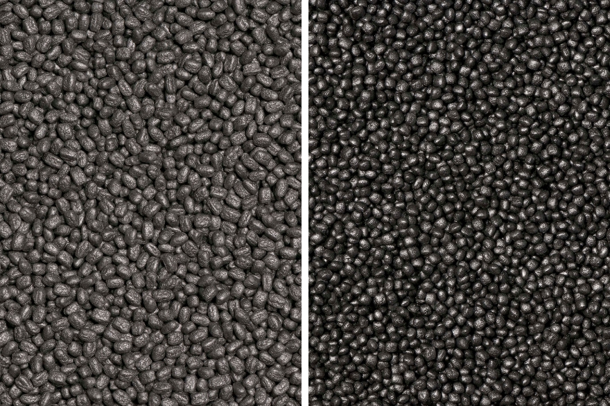 Primer plano lateral de gránulos de espuma expandida gris y negra para moldeo específico.