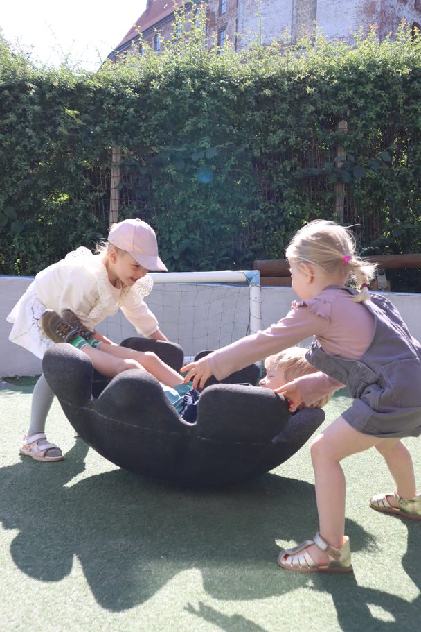 Three children playing with funiture made from ARPRO